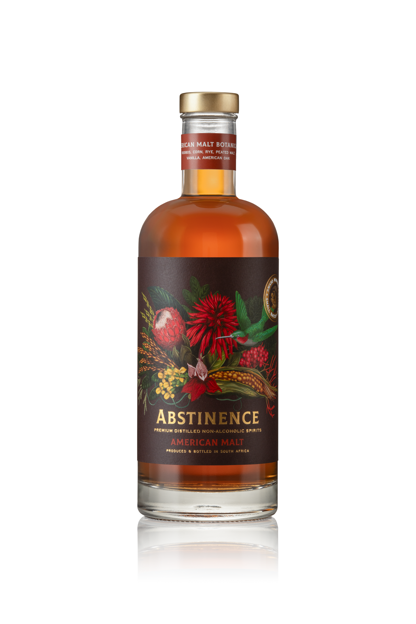A bottle of Abstinence Cape Malt non-alcoholic spirit with a label featuring floral and botanical artwork.